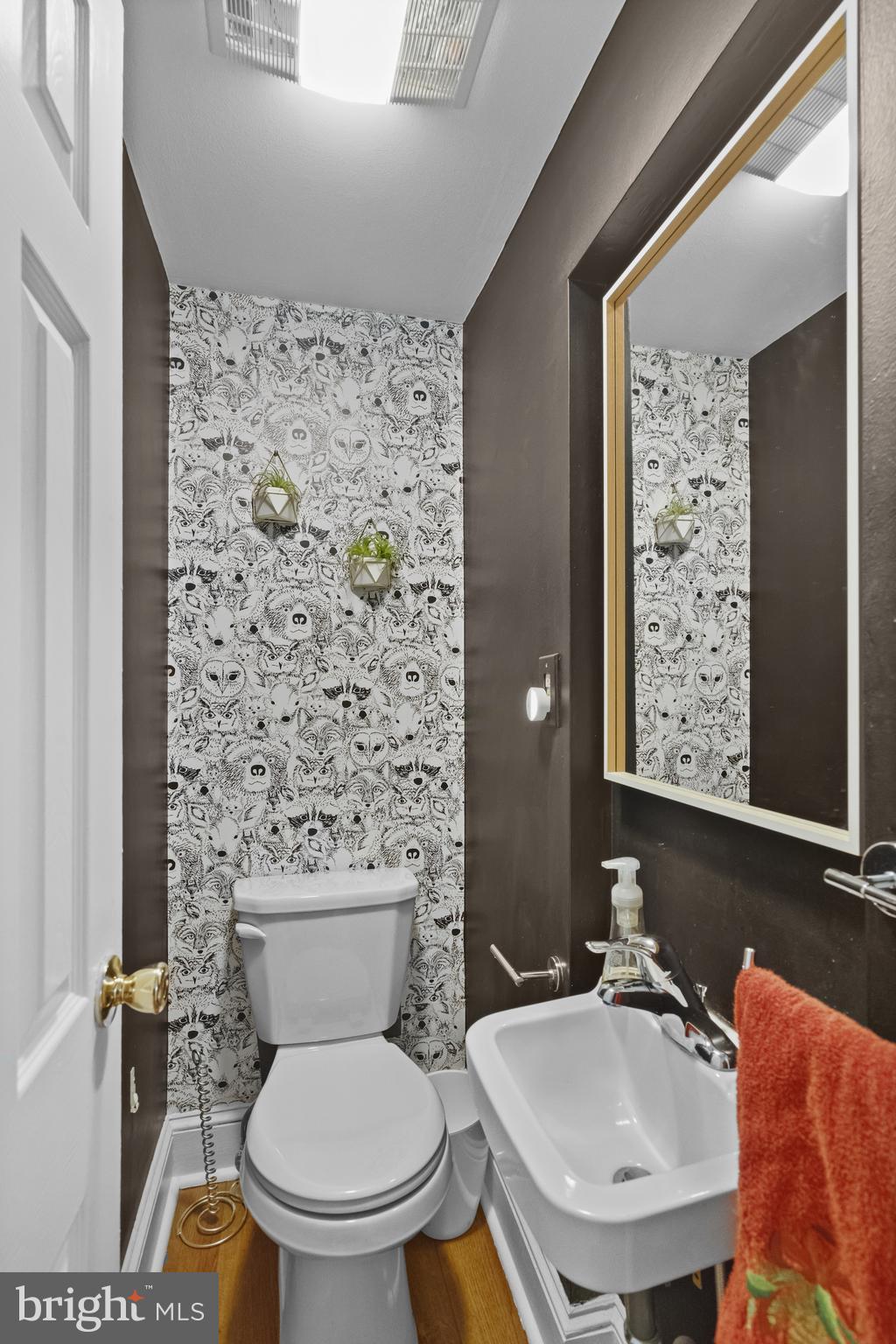 676 Glenmary Road Wayne, PA 19087 - Photo 15 of 38 a bathroom with a sink a toilet and shower curtain