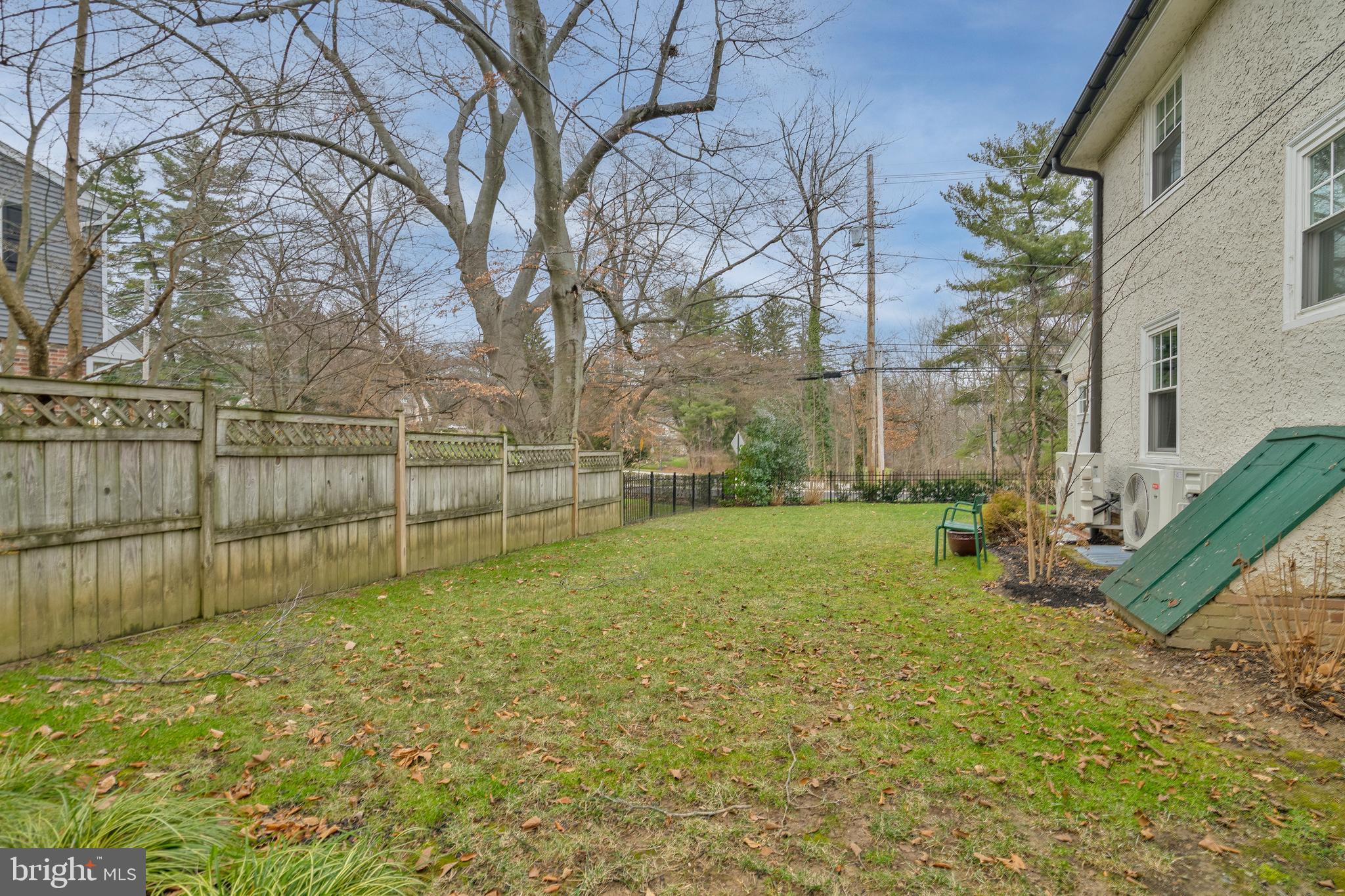 676 Glenmary Road Wayne, PA 19087 - Photo 18 of 38 a view of a yard with a bench