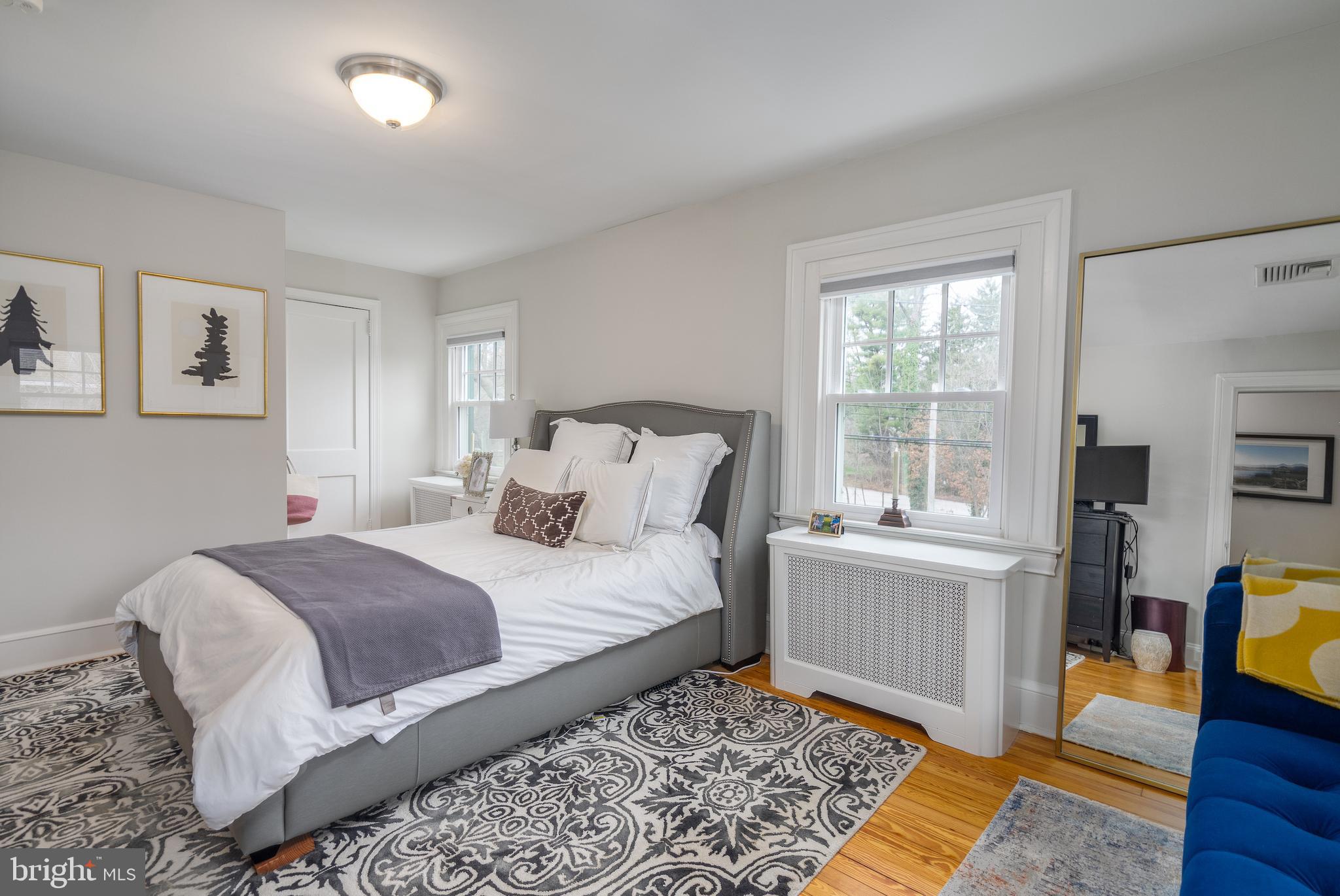 676 Glenmary Road Wayne, PA 19087 - Photo 21 of 38 a bedroom with a bed rug and a window