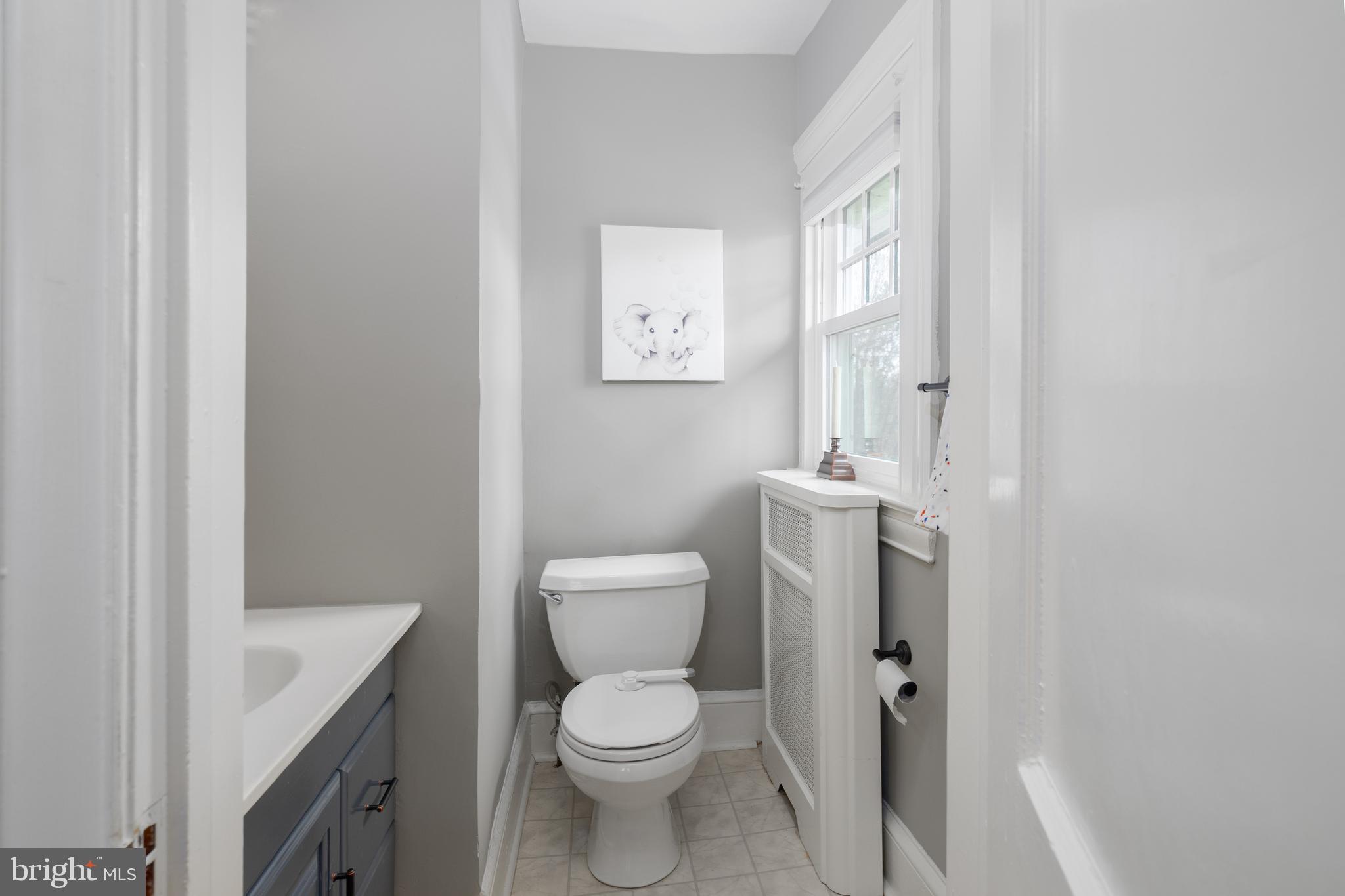 676 Glenmary Road Wayne, PA 19087 - Photo 30 of 38 a white toilet sitting next to a bathroom sink