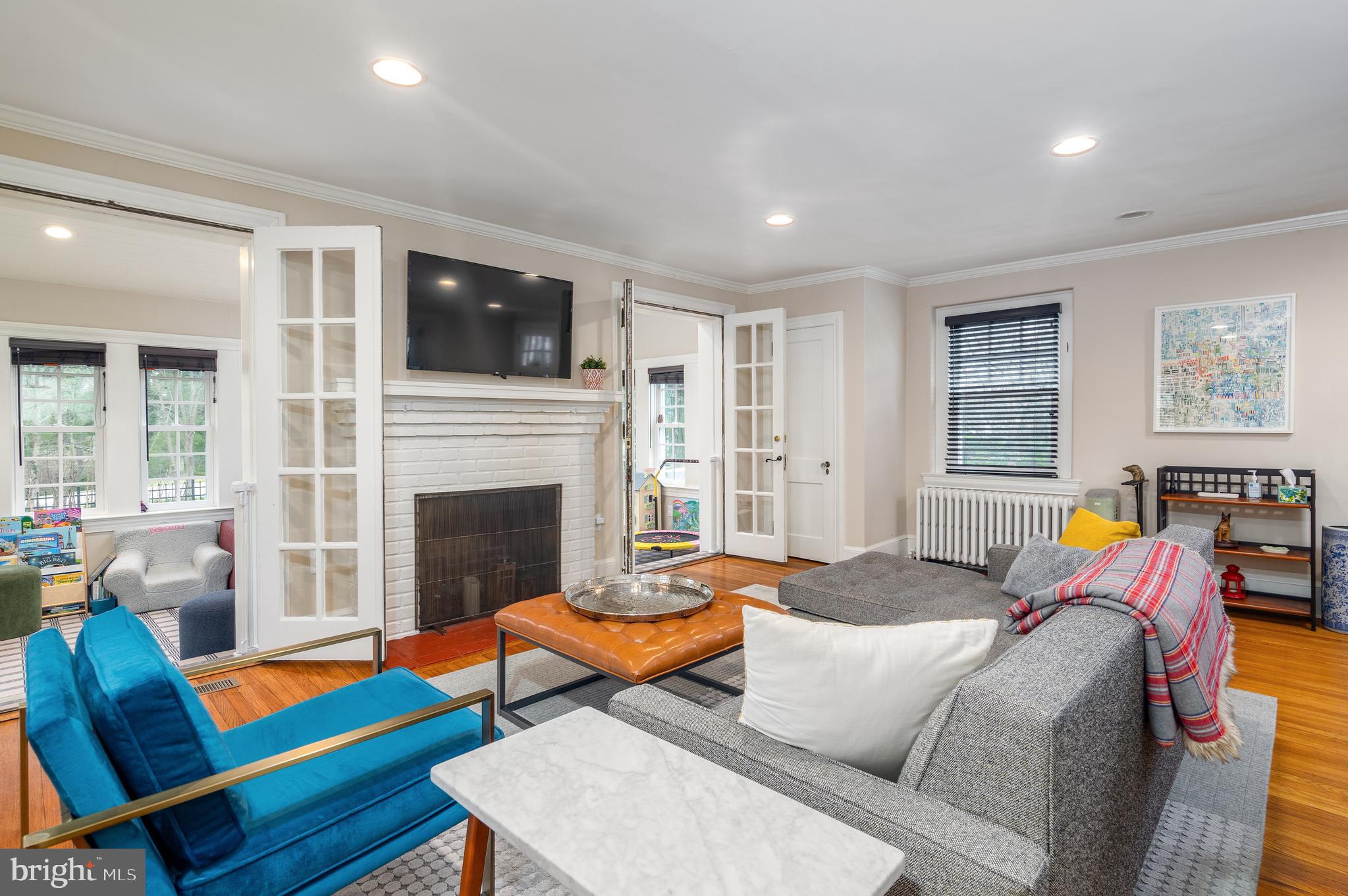 676 Glenmary Road Wayne, PA 19087 - Photo 5 of 38 a living room with furniture and a fireplace