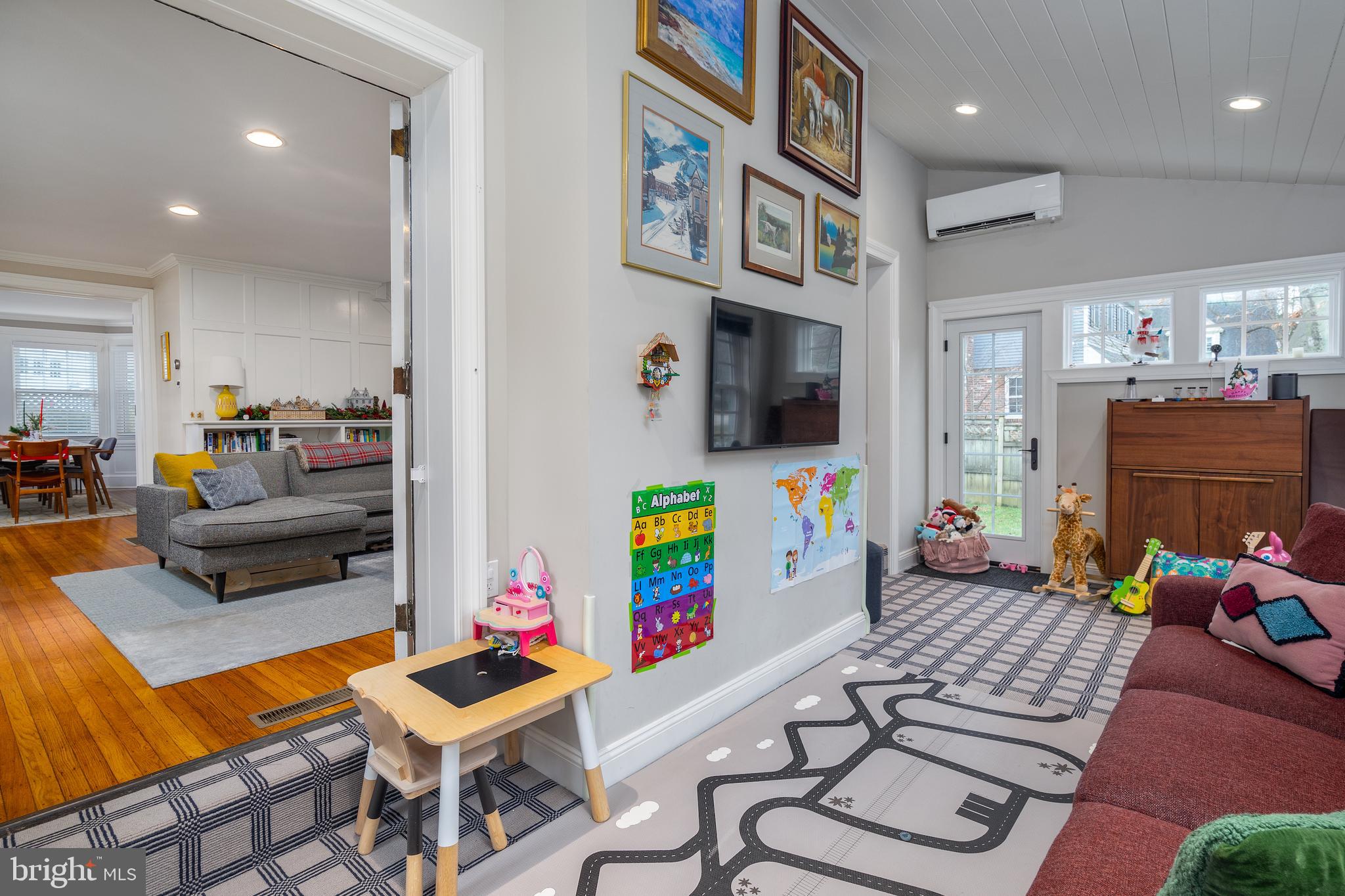 676 Glenmary Road Wayne, PA 19087 - Photo 7 of 38 a living room with furniture and a flat screen tv