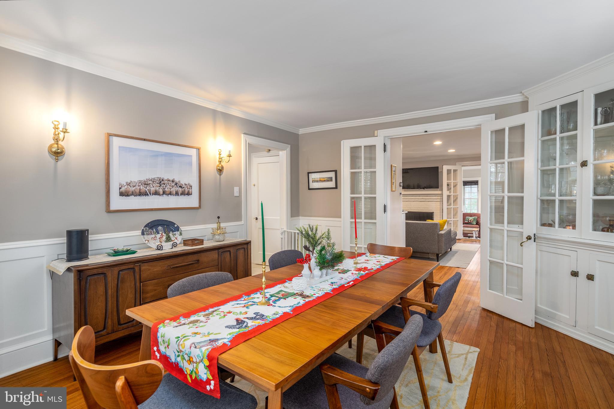 676 Glenmary Road Wayne, PA 19087 - Photo 9 of 38 a dining room with furniture a rug and wooden floor