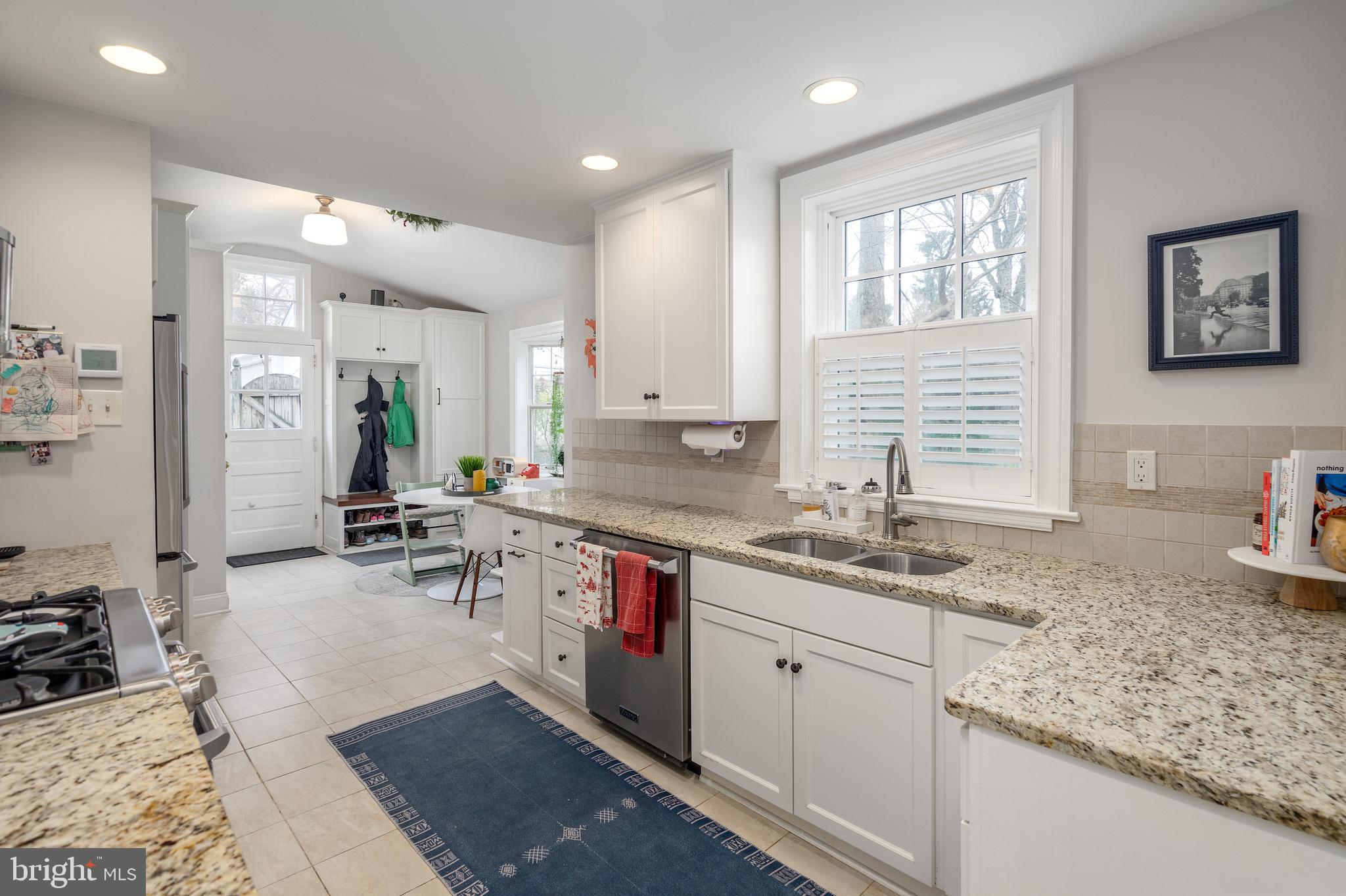 676 Glenmary Road Wayne, PA 19087 - Photo 10 of 38 a kitchen with a sink stove and cabinets
