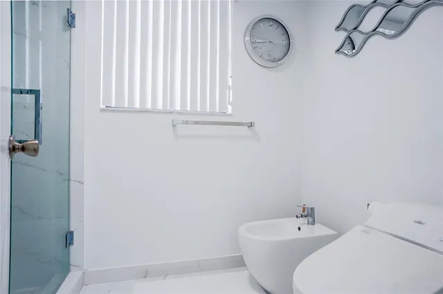 a bathroom with a toilet and a sink