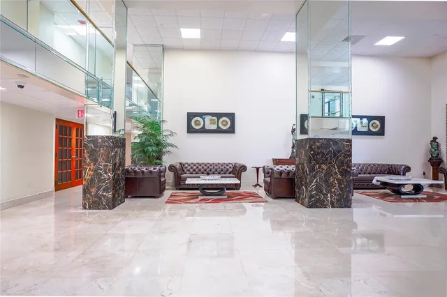 a bedroom with furniture a bed and a chandelier