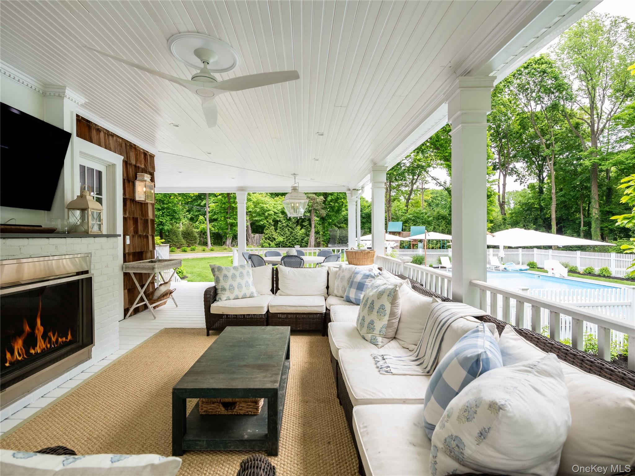 245 Lattingtown Road Locust Valley, NY 11560 - Photo 22 of 30 Porch w Gas fireplace