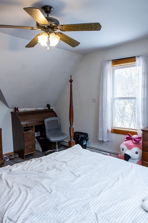 20 Paige Hill Road Brimfield, MA 01010 - Photo 36 of 40 a bedroom with a bed and a chandelier