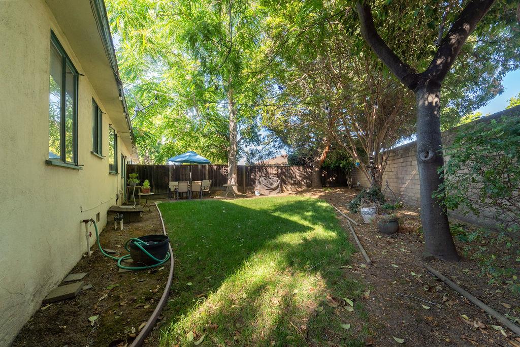 972 Michael Drive Campbell, CA 95008 - Photo 12 of 19 a backyard of a house with table and chairs