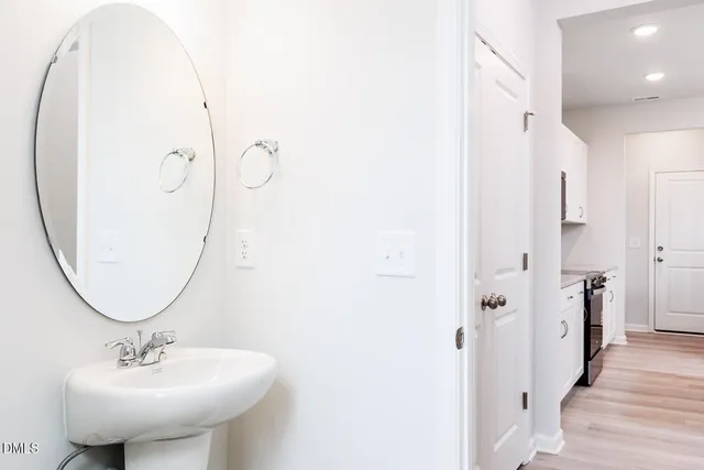 a view of a kitchen with a sink and cabinet
