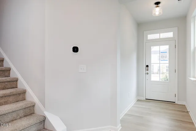 a view of kitchen with white cabinets
