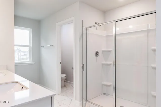 a bathroom with a sink vanity and a mirror
