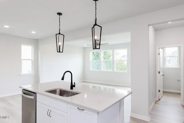 a bathroom with a sink and a window
