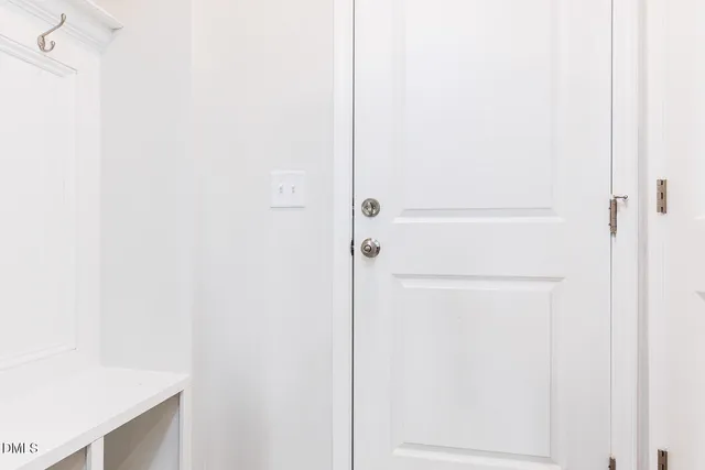 a view of a room with a ceiling fan