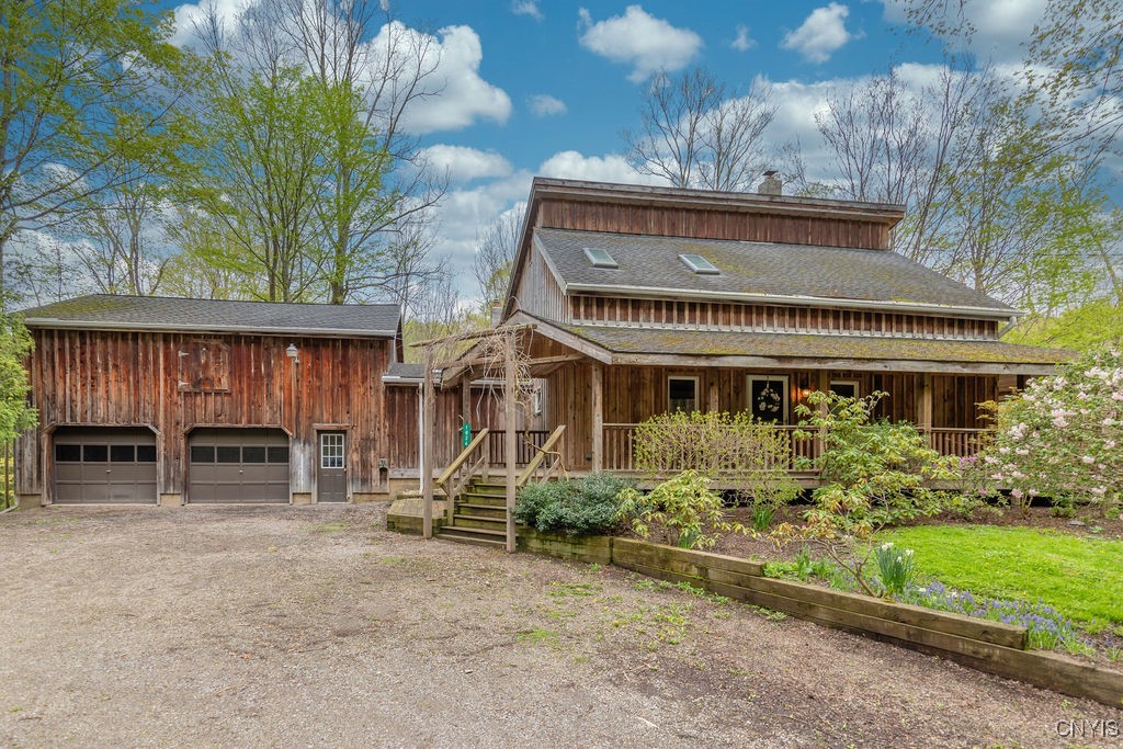 Rustic contemporary farmhouse perches above year-r