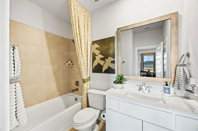 a bathroom with a sink a toilet and a bathtub