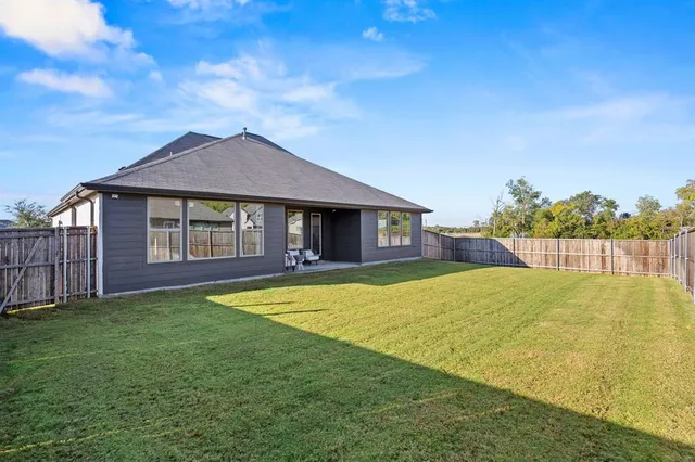 a house with swimming pool in front of it