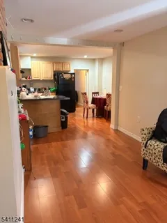 a view of a living room and dining room