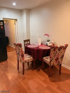 a reading room with furniture and wooden floor