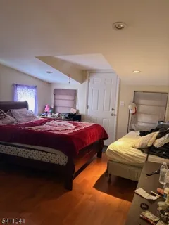 a bedroom with a bed and a closet
