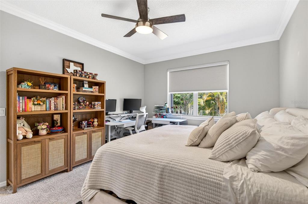 6427 Mooring Line Circle Apollo Beach, FL 33572 - Photo 27 of 34 a bedroom with a bed a window and book shelf