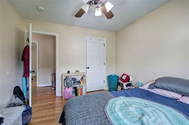 a bed room with a bed and a chandelier