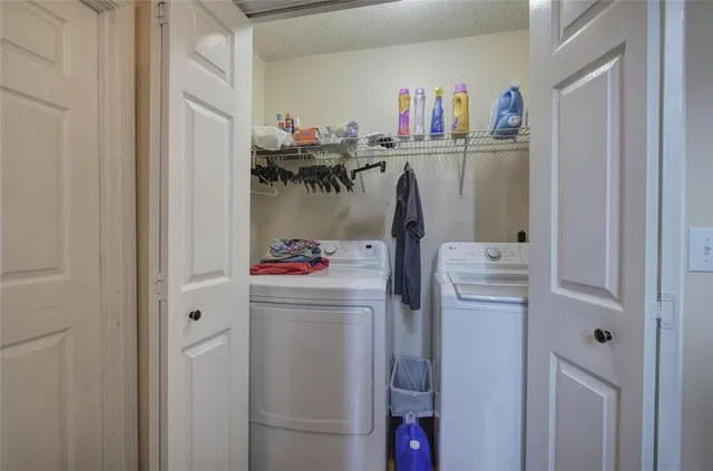 a view of a deck with two chairs and a yard