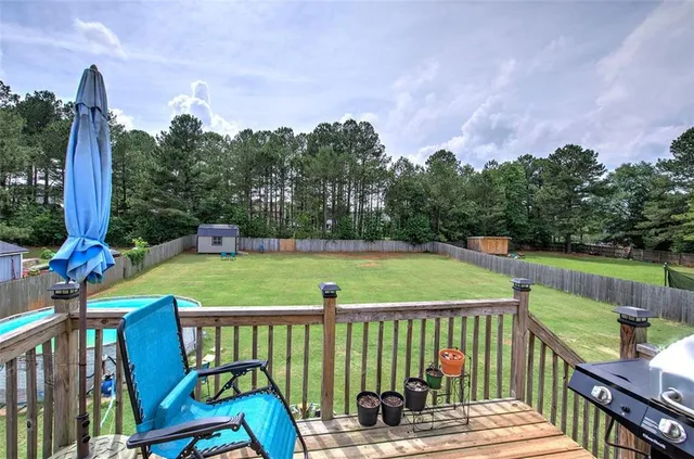 a bedroom with a bed and a large mirror with window