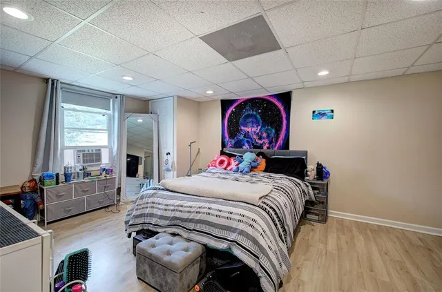 a bedroom with a bed and a view of bathroom