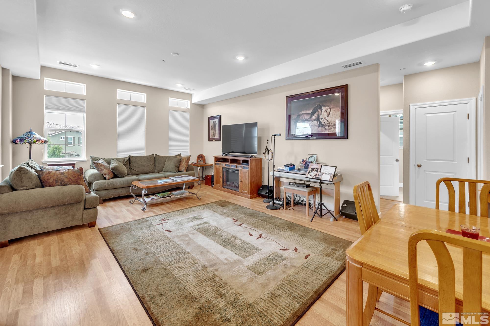 1880 Dark Horse Road, Unit A Reno, NV 89521 - Photo 8 of 20 a living room with furniture and a flat screen tv