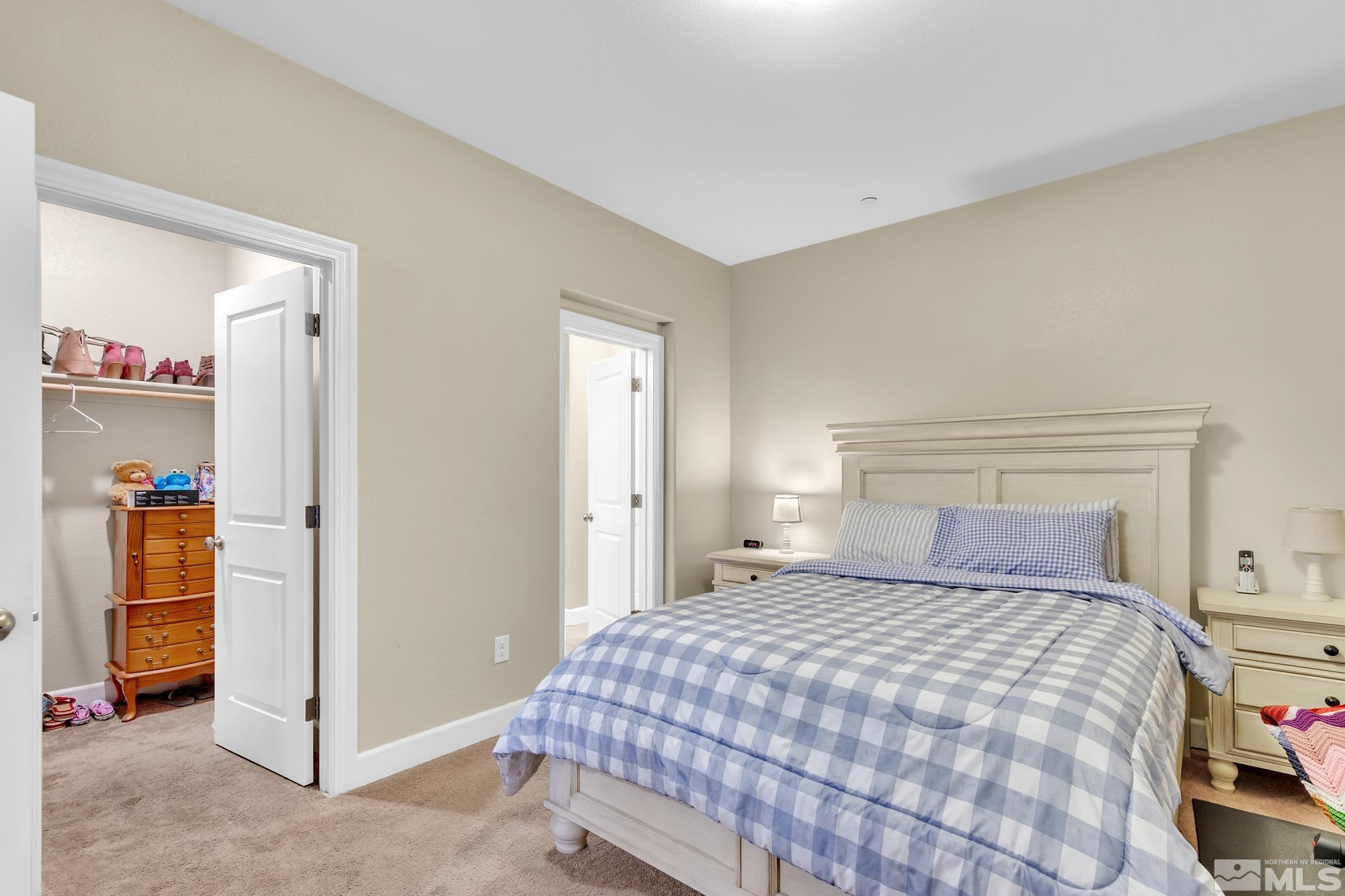 1880 Dark Horse Road, Unit A Reno, NV 89521 - Photo 9 of 20 a bedroom with a bed and a view of bedroom