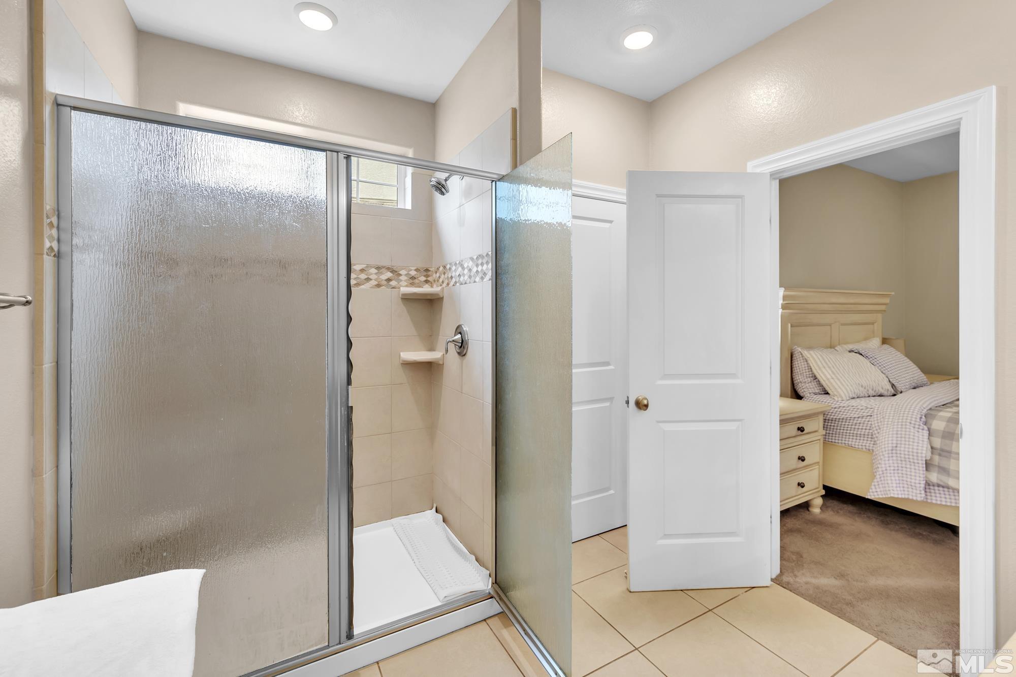 1880 Dark Horse Road, Unit A Reno, NV 89521 - Photo 10 of 20 a bathroom with a glass shower door