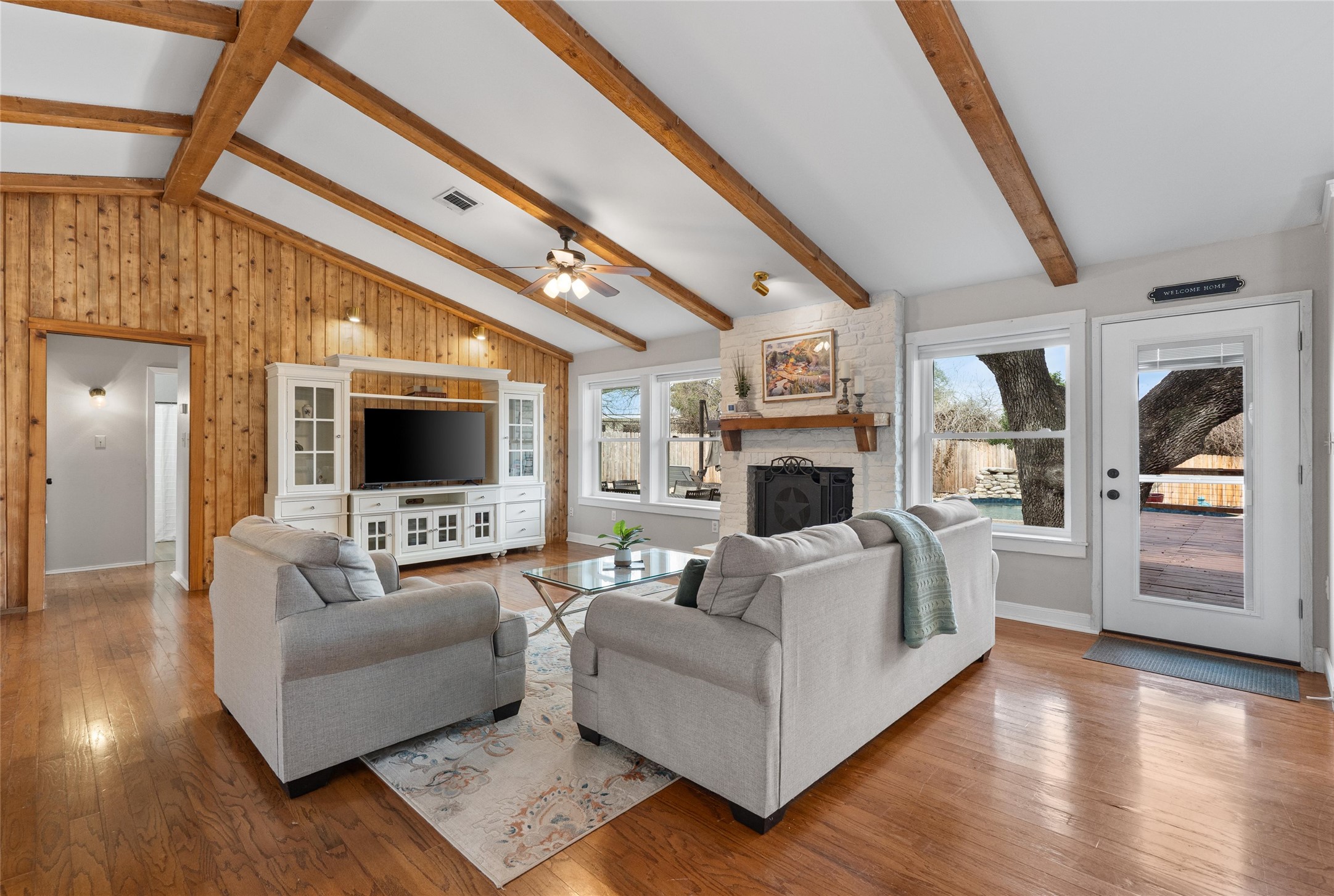 720 Circle G Ranch Road Austin, TX 78737 - Photo 15 of 37 a living room with furniture and a flat screen tv