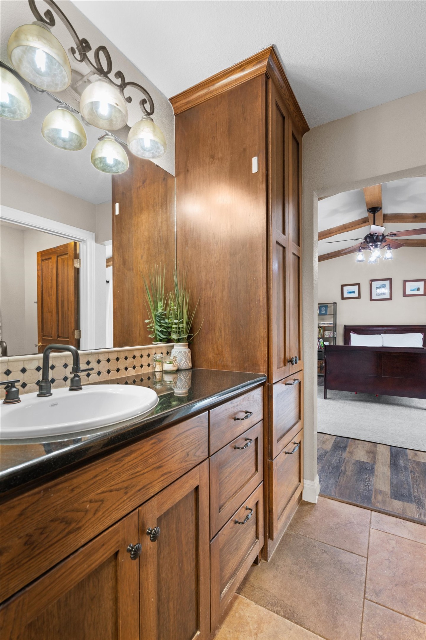 720 Circle G Ranch Road Austin, TX 78737 - Photo 18 of 37 a bathroom with a sink double vanity and a mirror