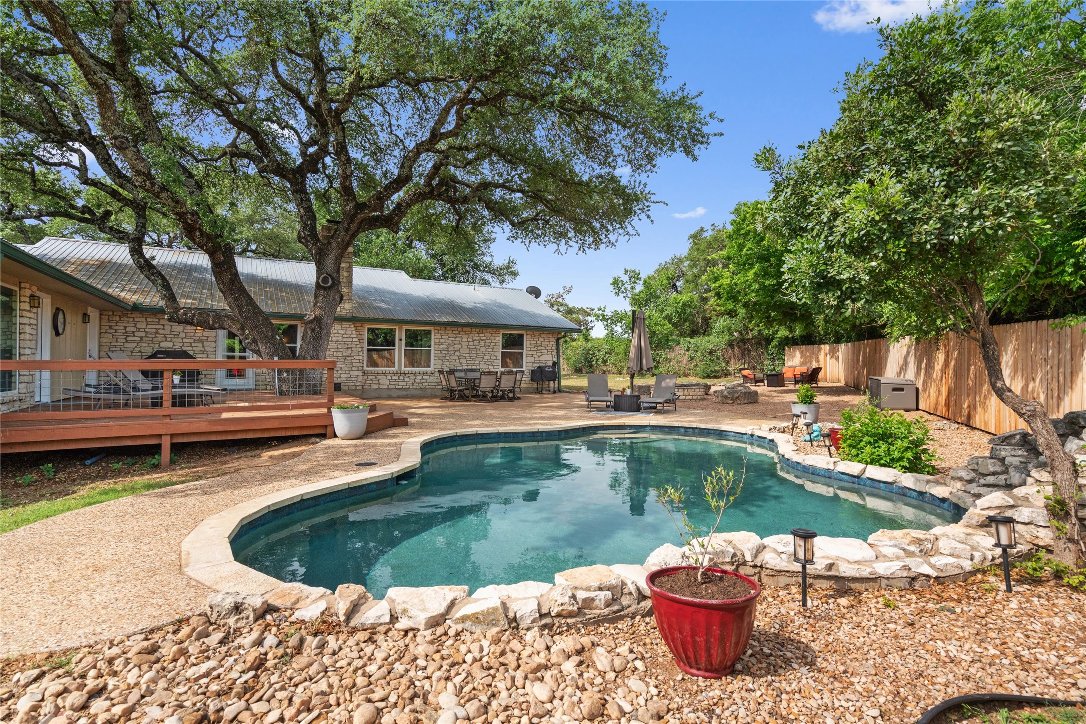 720 Circle G Ranch Road Austin, TX 78737 - Photo 27 of 37 a view of a swimming pool with a patio