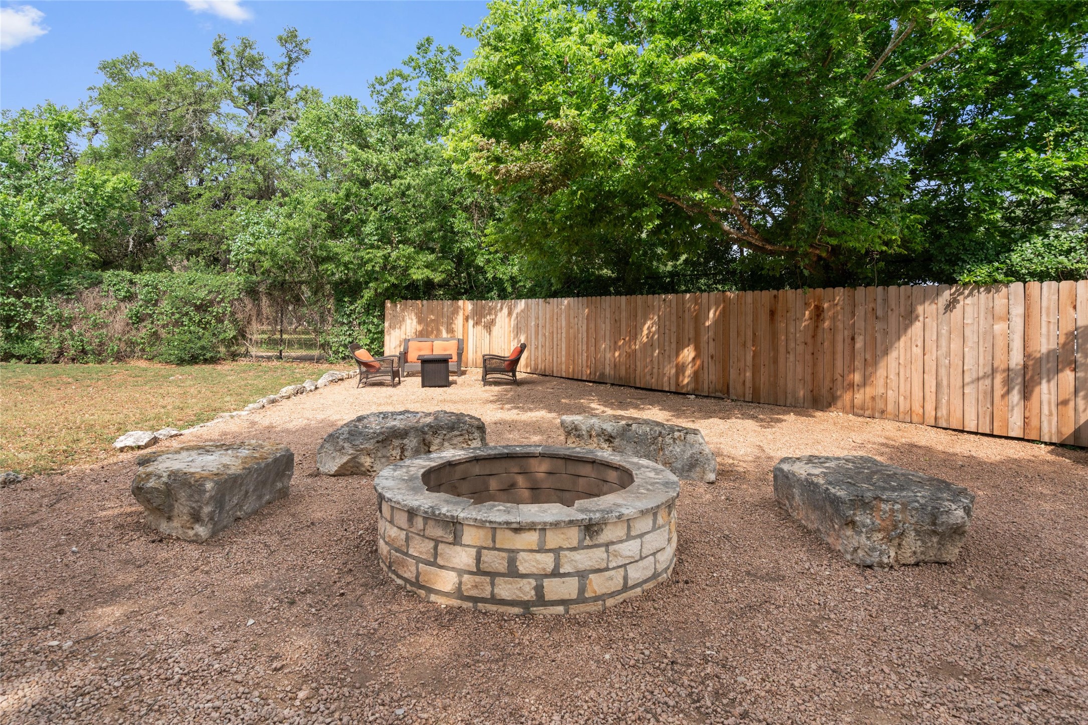 720 Circle G Ranch Road Austin, TX 78737 - Photo 31 of 37 a view of a backyard with water fountain and large trees