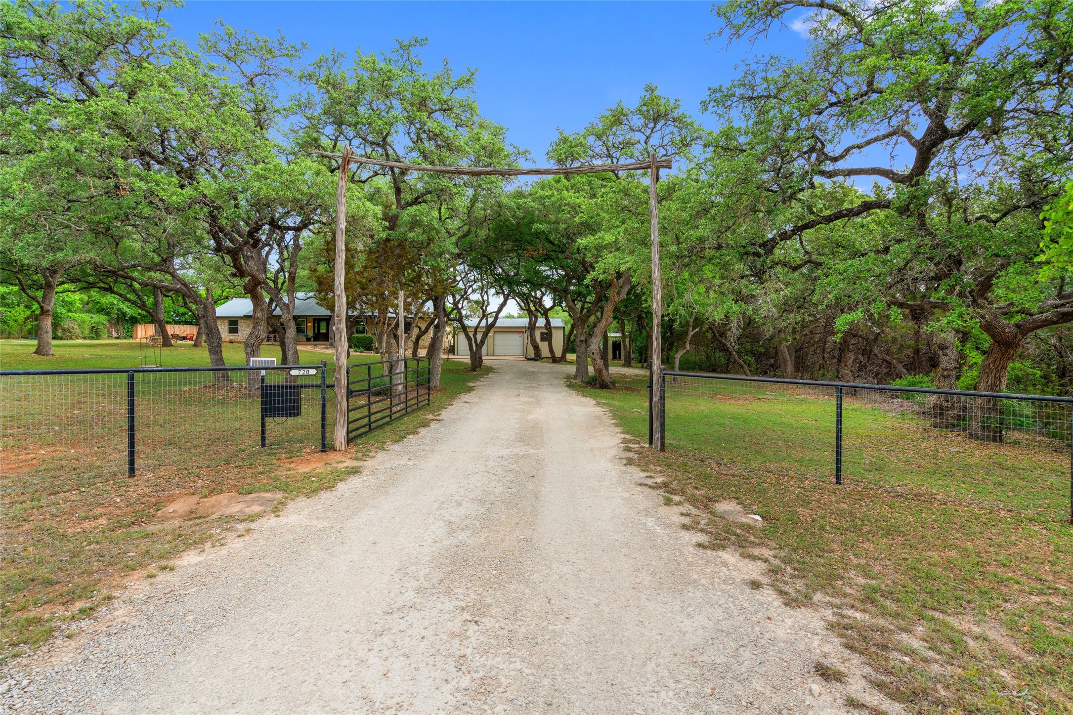 720 Circle G Ranch Road Austin, TX 78737 - Photo 7 of 37 a view of a park with swings on the wall