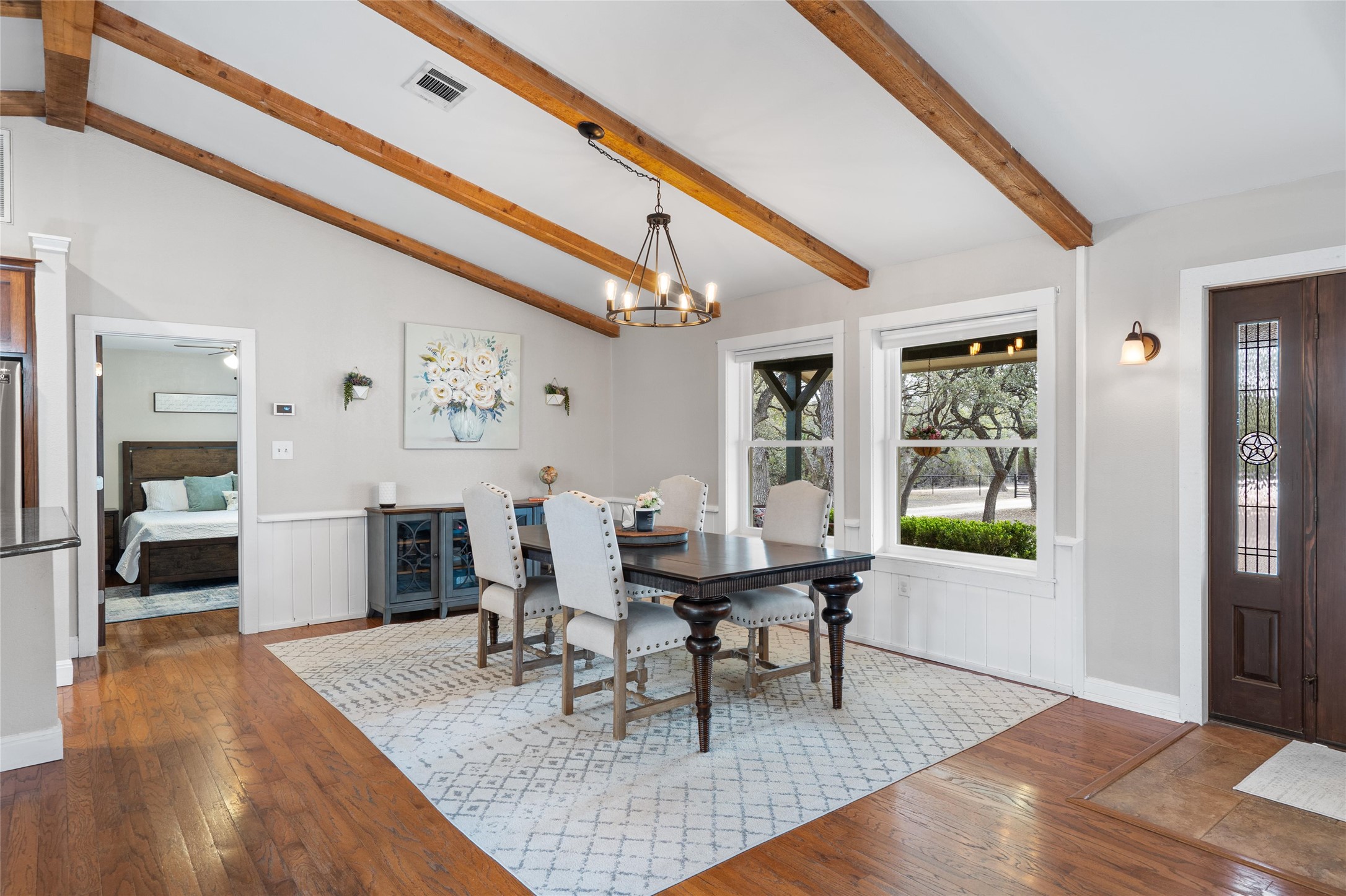 720 Circle G Ranch Road Austin, TX 78737 - Photo 9 of 37 a dining room with furniture and window