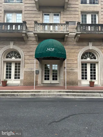 a view of a hallway with a black and white dining table