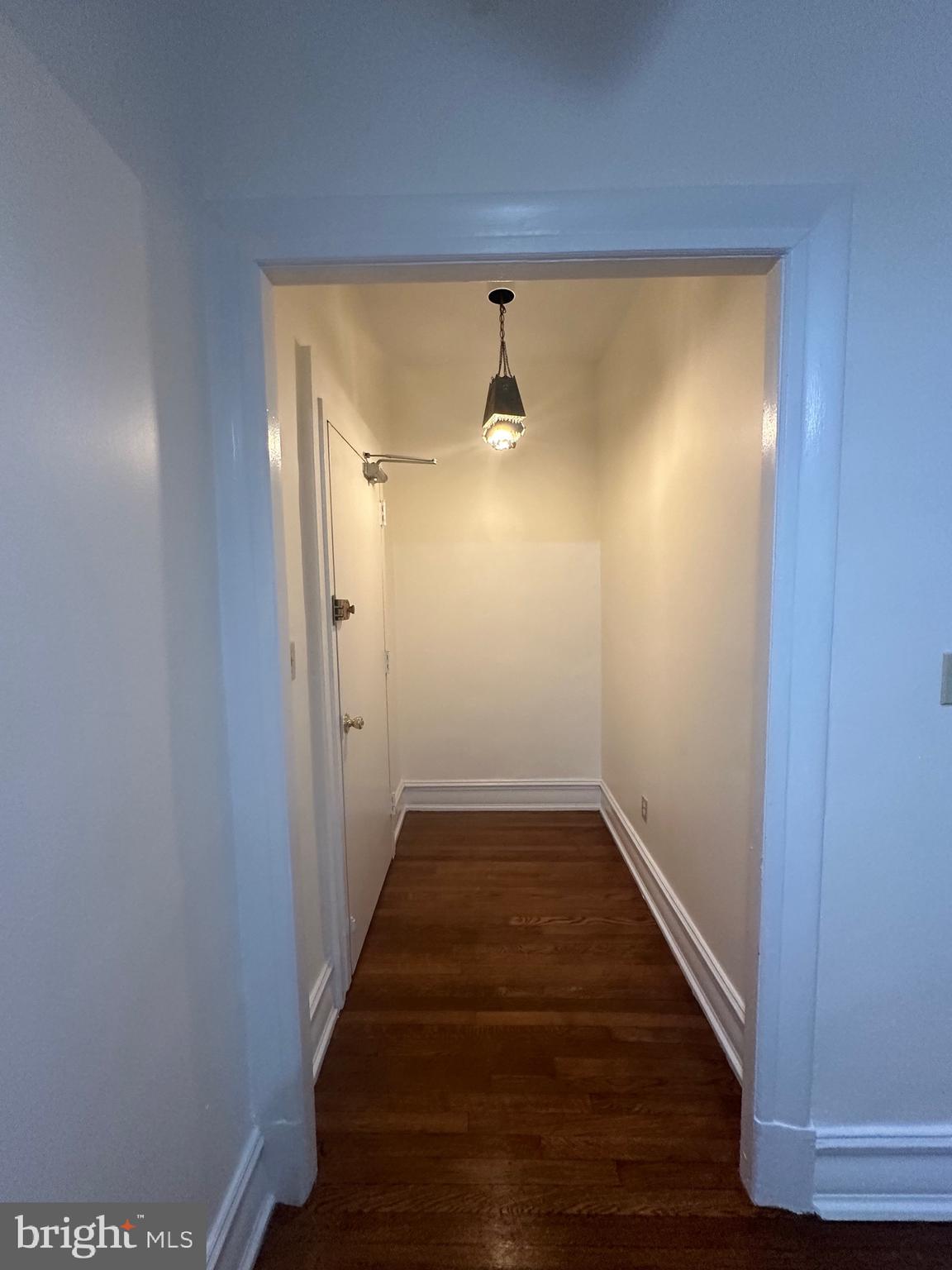 3420 16th Street Northwest, Unit 103 Washington, DC 20010 - Photo 10 of 24 a view of a hallway with wooden floor