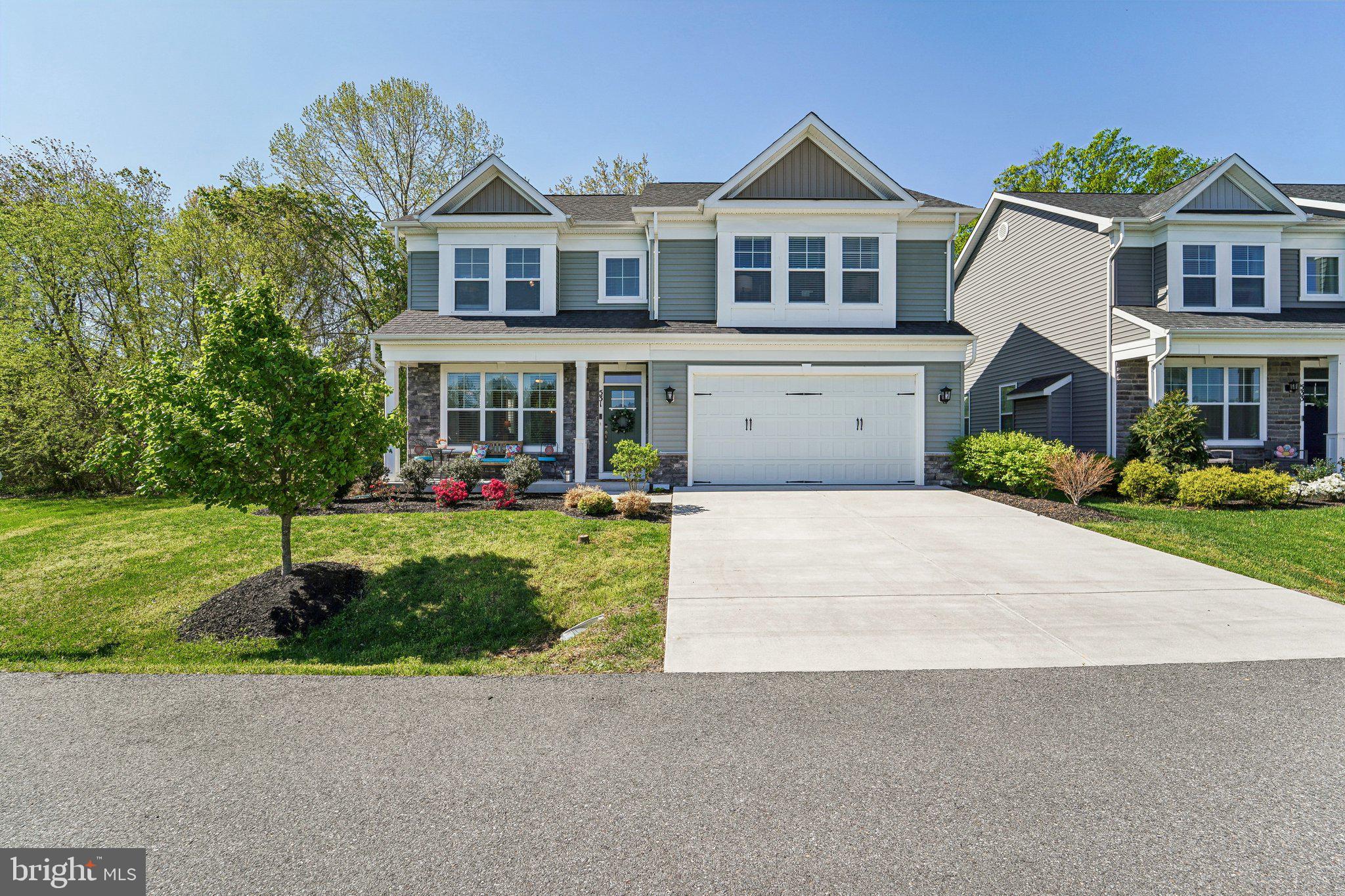 front view of a house with a yard