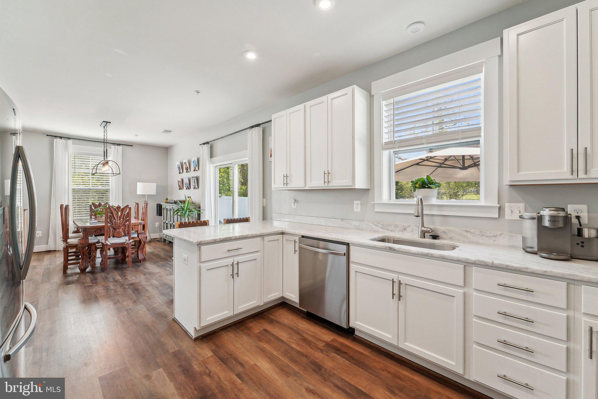 531 Highmeadow Drive Severn, MD 21144 - Photo 15 of 37 a kitchen with sink cabinets and wooden floor
