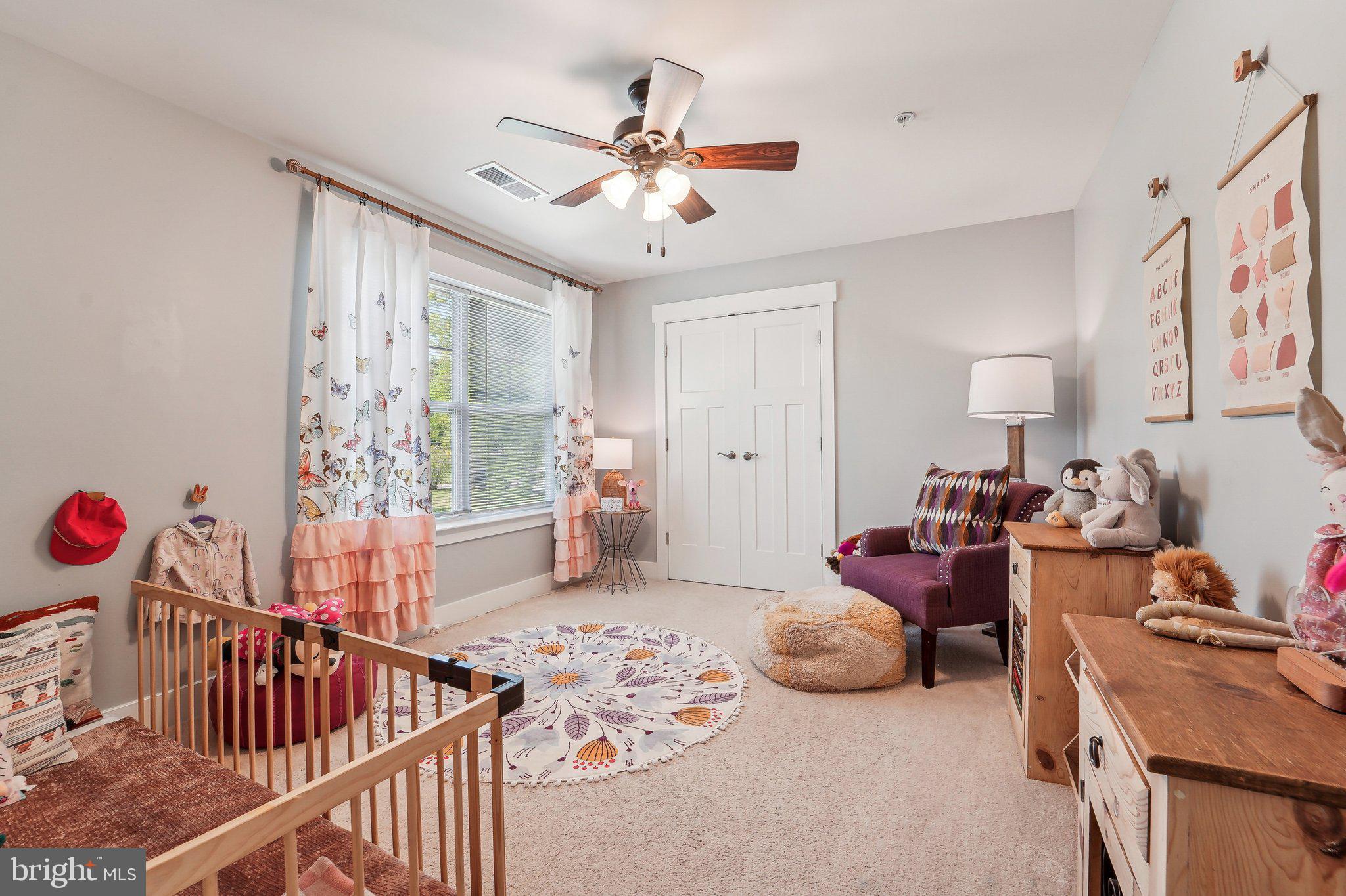 531 Highmeadow Drive Severn, MD 21144 - Photo 18 of 37 a bedroom with furniture and a chandelier