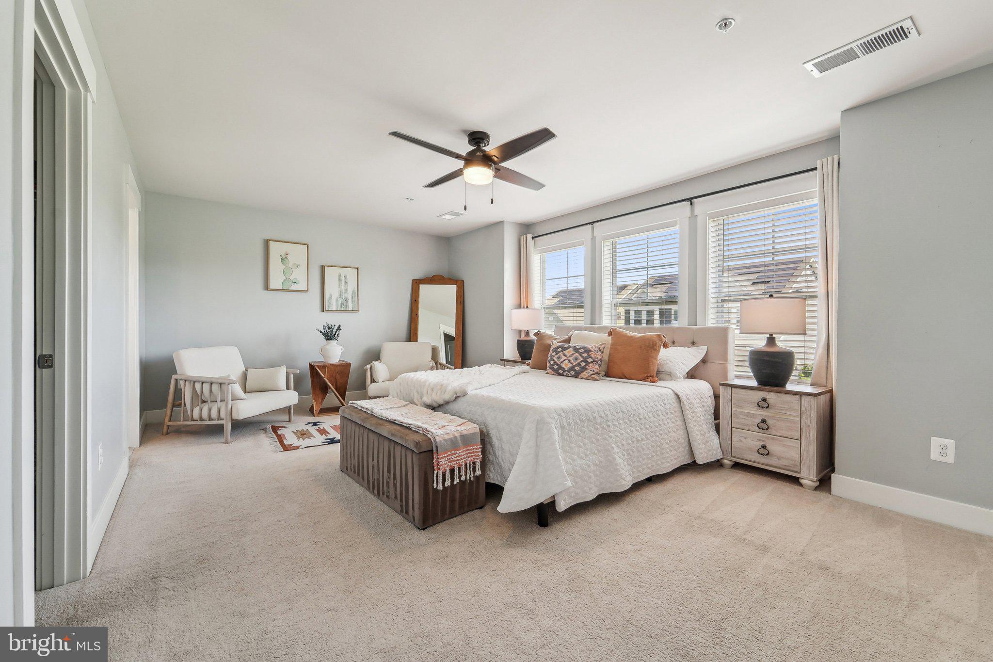 531 Highmeadow Drive Severn, MD 21144 - Photo 20 of 37 a bed room with a bed and a chandelier