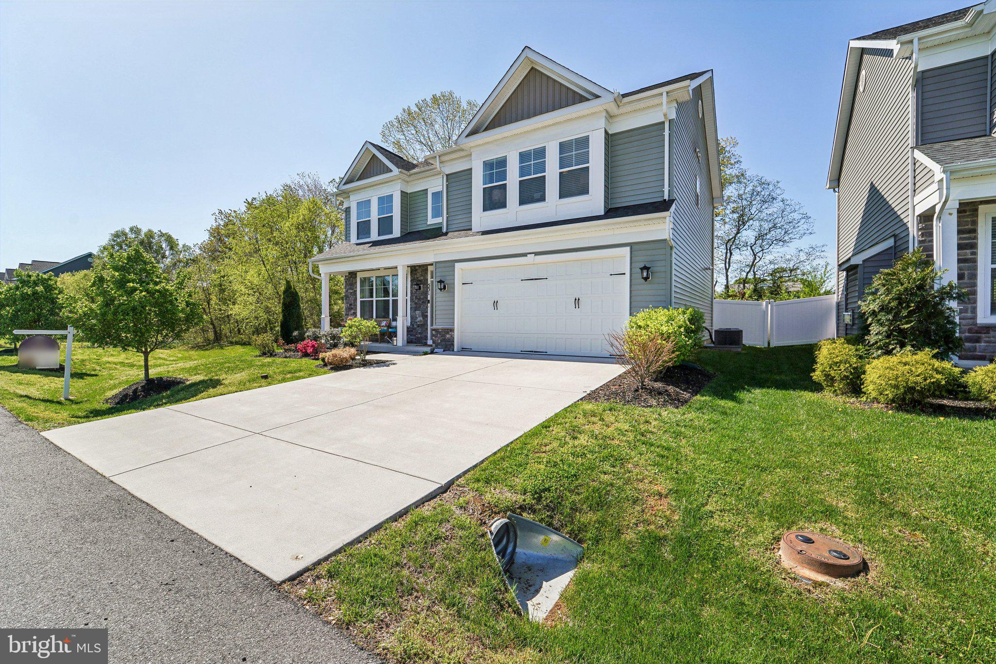 531 Highmeadow Drive Severn, MD 21144 - Photo 2 of 37 a front view of a house with a yard and garage