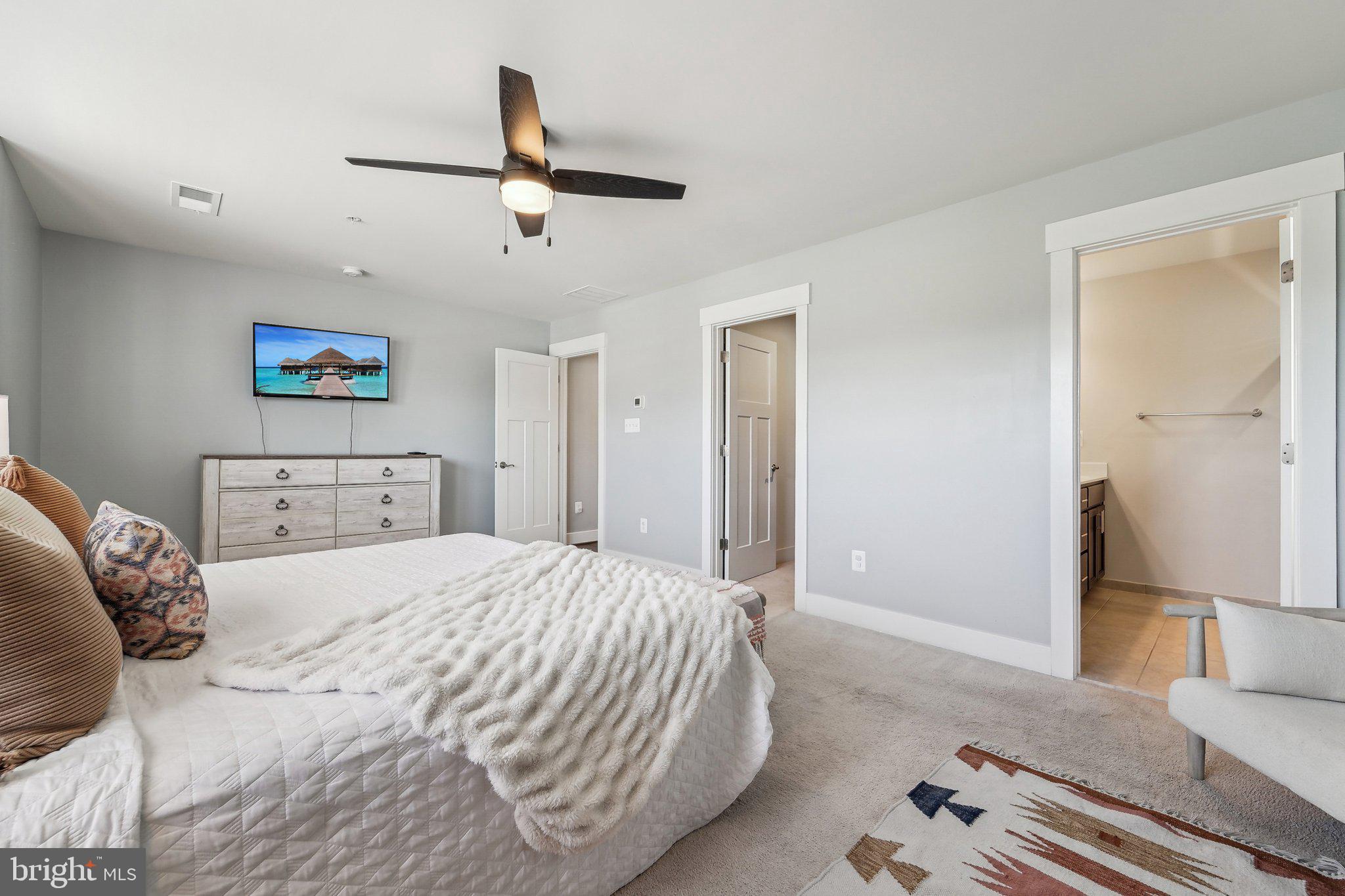 531 Highmeadow Drive Severn, MD 21144 - Photo 21 of 37 a bedroom with a bed and a refrigerator