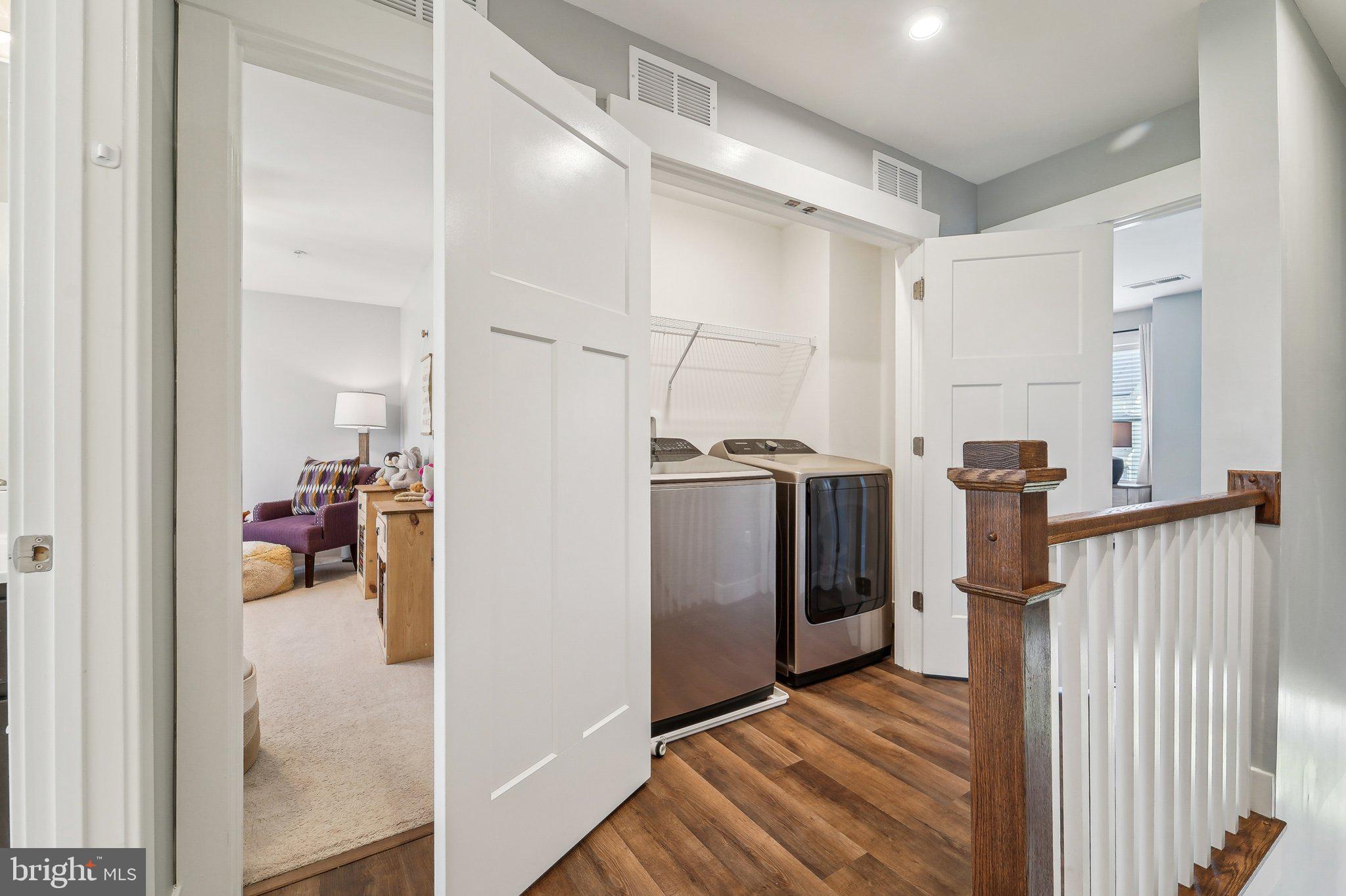 531 Highmeadow Drive Severn, MD 21144 - Photo 24 of 37 a view of a hallway with wooden floor and staircase