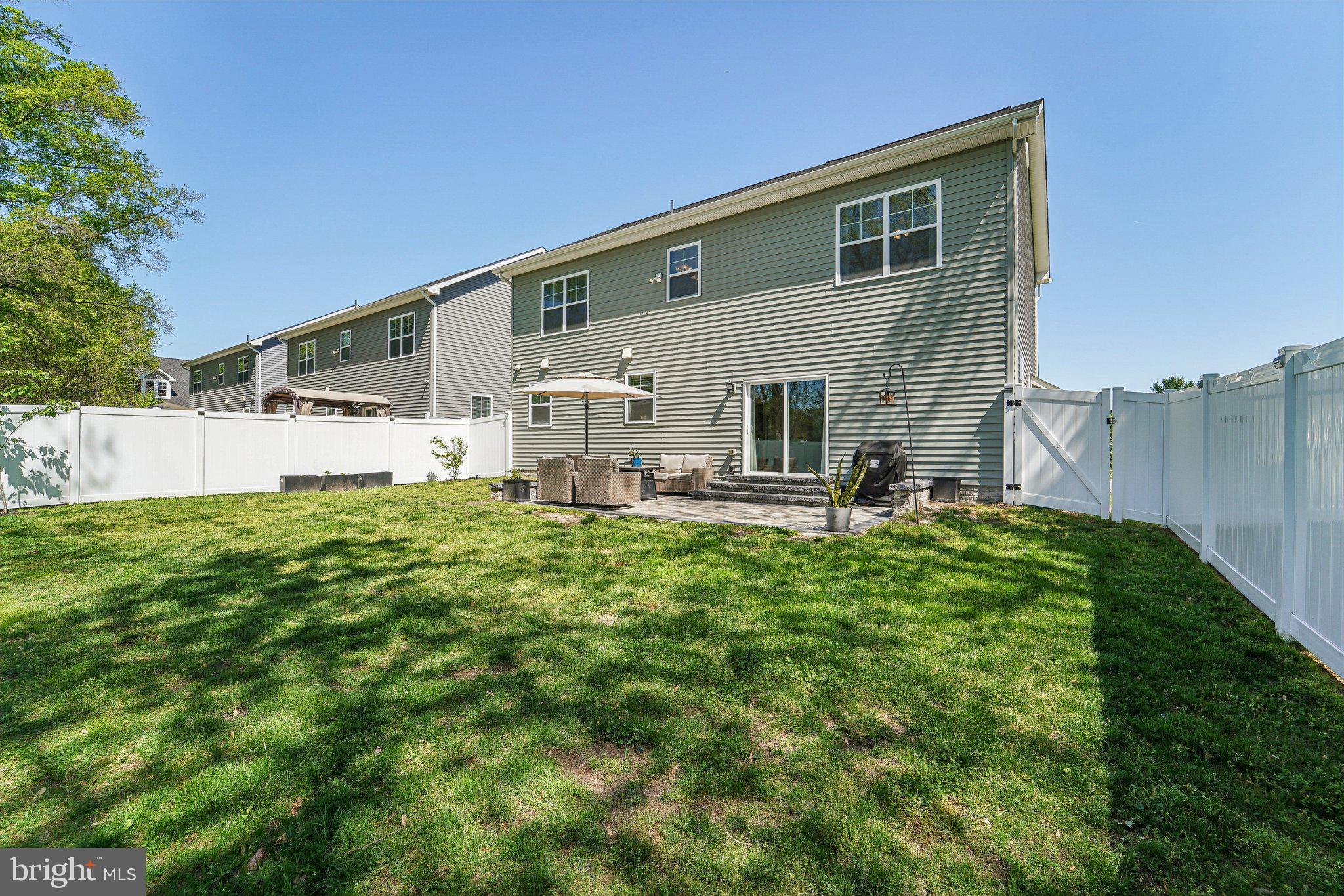 531 Highmeadow Drive Severn, MD 21144 - Photo 32 of 37 a backyard of a house with table and chairs