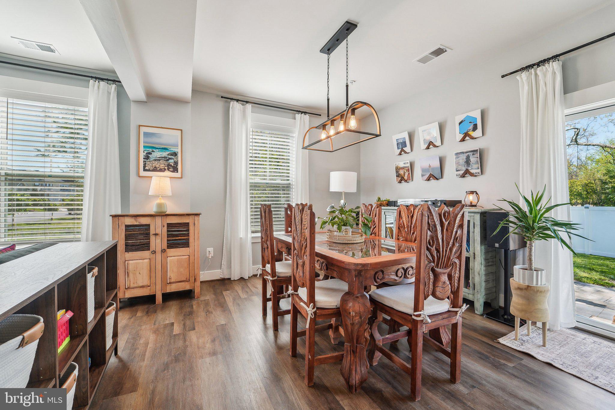 531 Highmeadow Drive Severn, MD 21144 - Photo 10 of 37 a view of a dining room with furniture window and wooden floor
