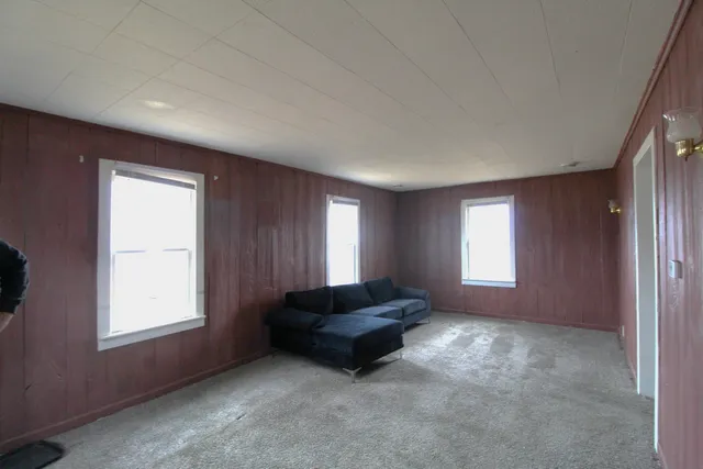 a living room with a couch and a window